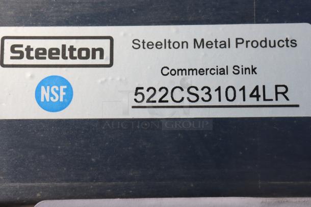 Steelton 54" stainless steel 3-compartment commercial sink label, model 522CS31014LR, with NSF certification visible.
