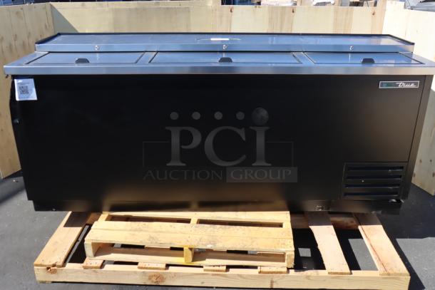 True TD-80-30-HC black horizontal bottle cooler, scratch-and-dent condition, 80 1/8", 115V, 2.8A, shown on a pallet.