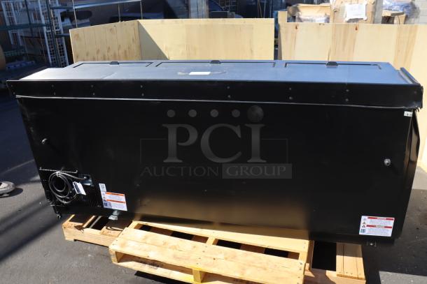 True TD-80-30-HC black bottle cooler with scratches and dents, on pallet. Model and safety labels visible.