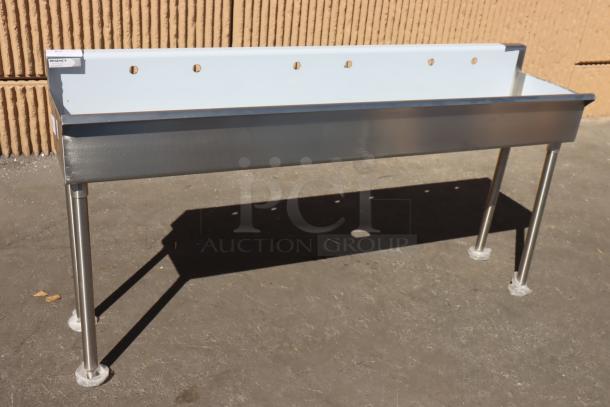 Brand new Regency 600FHDMS1872 stainless steel hand sink, 72"x17.5", three 8" faucet centers, may lack small pieces.