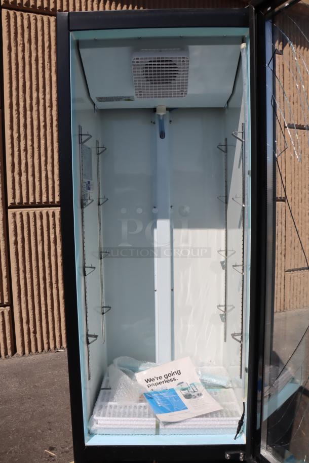Avantco GDC-10-HC glass door merchandiser fridge; broken glass, missing panels, and power cord; for parts. Serial: 907780901 7426 2501.