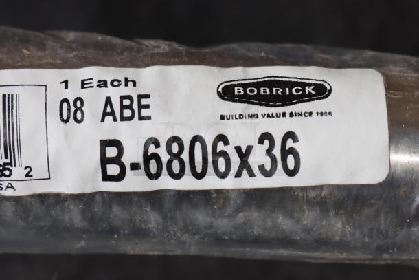 BRAND NEW Bobrick B-6806 36" grab bar. Out of packaging, possible scratches. Label shows model and logo.