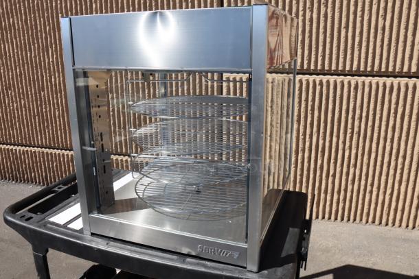 ServIt PDW18D1S display warmer, 18" with 4 shelves, dented, missing back & right side glass, door on top, serial #1685004080132.