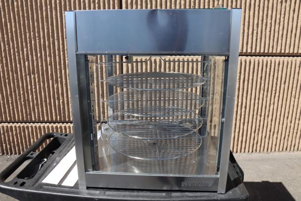 Brand new ServIt PDW18D1S display warmer, dented, missing back & right glass panels, door on top, with 4 shelves.