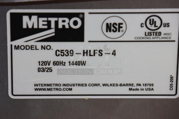 Metro C539-HLFS-4 hot holding cabinet label showing model, 120V, 1,440W. Made in USA. Wheel bent, power cord damaged.