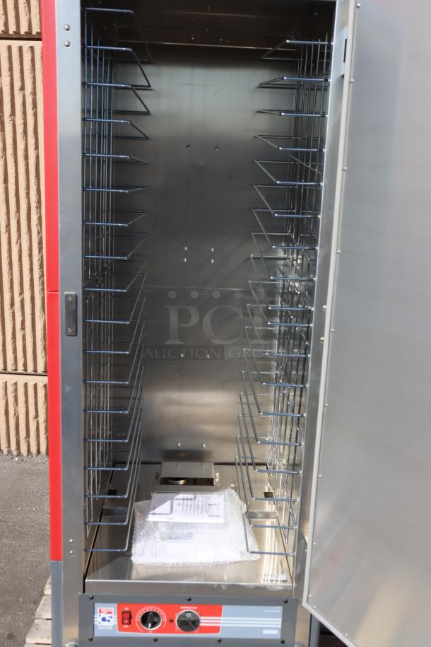Metro C539-HLFS-4 hot holding cabinet, red, fixed wire slides, solid door. New, scratch-n-dent; bent wheel, damaged power cord.
