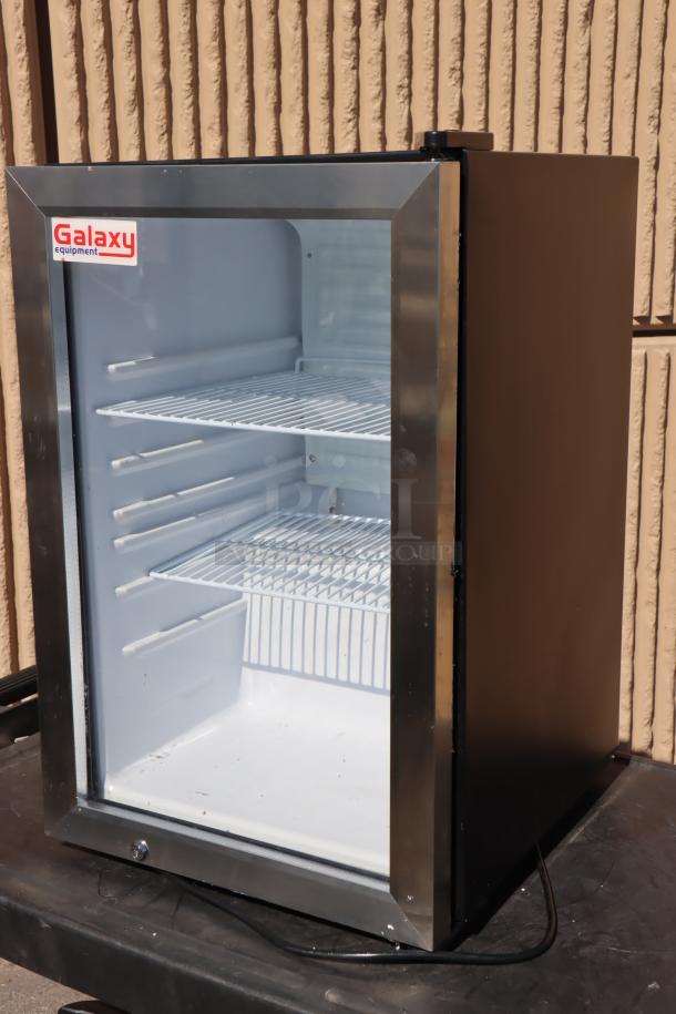 Brand new Galaxy CRG3B black countertop display merchandiser, 2.5 cu ft, 115V, 1.1A; minor dents, glass door, adjustable shelves.