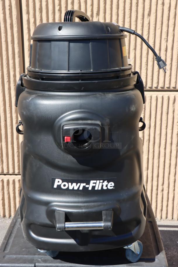 Powr-Flite PF56 20 Gallon Wet/Dry Vacuum, black, scratch-n-dent, missing pieces, front wheels need servicing. Serial No.: 24D 3028.