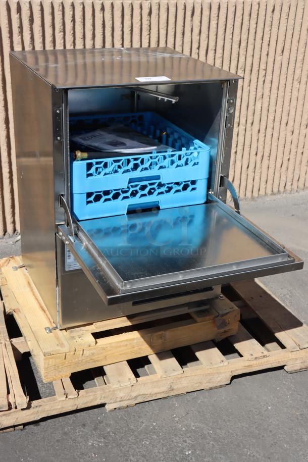 Noble Warewashing WAREFORCE UL-30 dishwasher on pallet, new condition, blue dish rack inside, built-in chemical pumps visible.