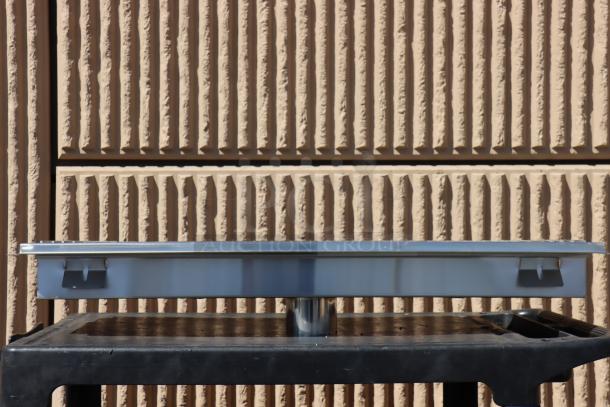 BRAND NEW Regency 600FT1242SS 12"x42" stainless steel floor trough with grate; 2 bent fins on the grate.