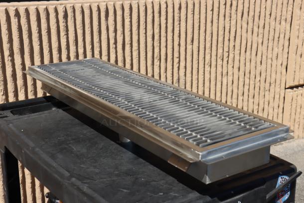 Regency 600FT1242SS 12"x42" stainless steel floor trough with grate, scratch-n-dent, two bent fins on one side.