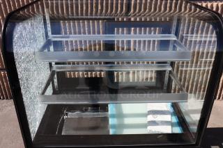 Avantco BC-36-HC refrigerated bakery display case, 36", curved glass, broken left glass, black, 115V, 1 phase.
