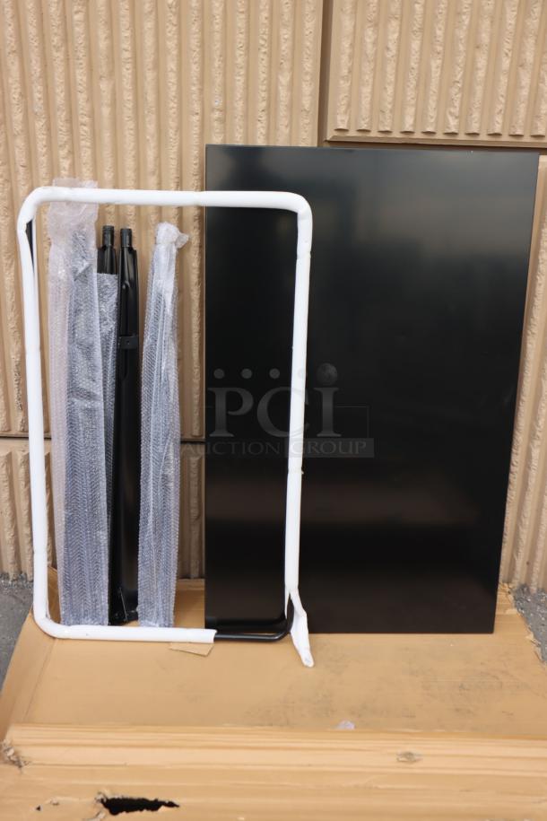 Brand new Lancaster Table & Seating Alloy 48" x 30" black bar height outdoor table, unassembled, with packaging.