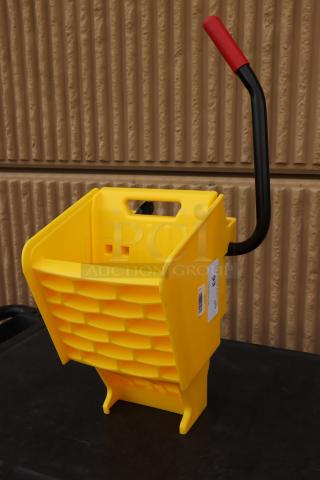 Brand new Rubbermaid® 2064959 WaveBrake® yellow mop wringer, durable plastic, down press design, with handle, labeled.