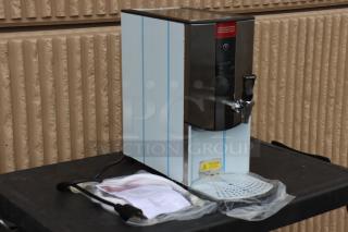 Brand new Grindmaster 2403-001 1.3-gallon hot water dispenser, 240V, 2900W. Missing original packaging, possible small pieces.