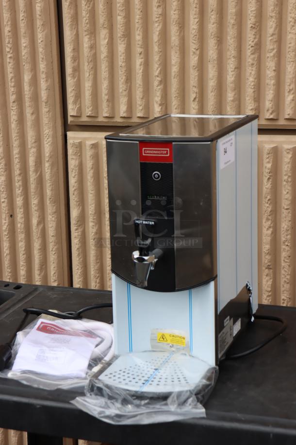 Brand new Grindmaster 2403-001 hot water dispenser, 1.3 gallon capacity, 240V, 2900W, tap-operated, out of original packaging.