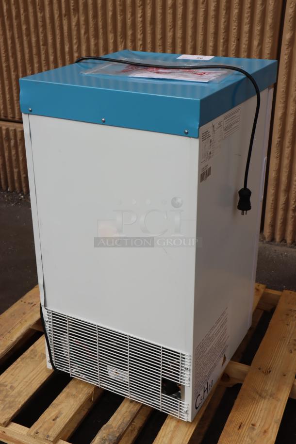 NEW SCRATCH-N-DENT Summit ACR32G 3.17 Cu. Ft. Compact Glass Door Medical Refrigerator in white/blue on a pallet, back view.