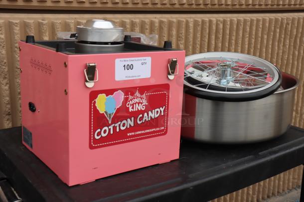 Carnival King CCM21CTK cotton candy machine, new condition, pink with logos, includes 21" stainless steel bowl and floss bubble. Serial No.: 1124. May be missing parts.