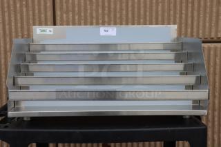 Brand new Regency 600LDR2336 five-tier stainless steel liquor display rack, 36" wide, 23" deep, minor scratches.