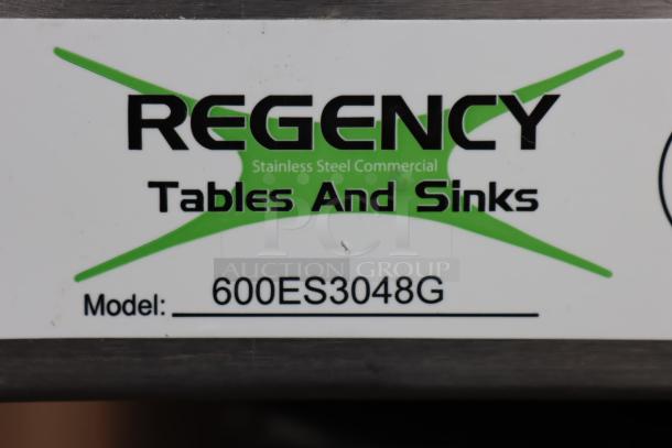 Regency 600ES3048G label showing model details for a 30" x 48" stainless steel equipment stand with galvanized undershelf.