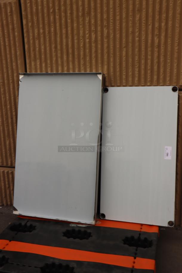 BRAND NEW Scratch-N-Dent Regency 600ES3048G 30"x48" stainless steel equipment stand, visible minor dents, with galvanized undershelf.