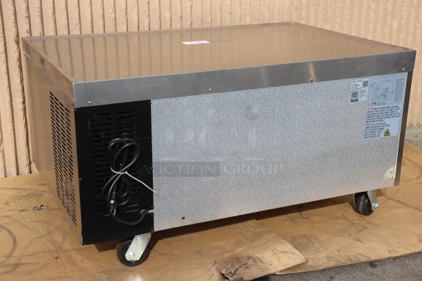 Brand new Avantco CBE-48-HC 48" refrigerated chef base with two drawers, 115V, 4.32A, 1 phase, 343W, on wheels.
