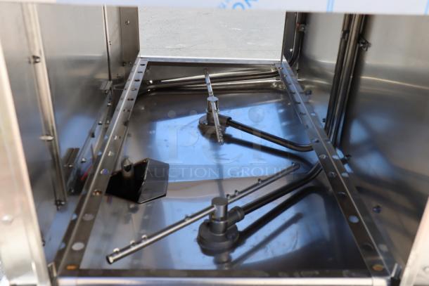 Brand new Noble Warewashing II double rack dishwasher interior view, low temp, model WAREFORCE II, 115V. Bent top control panel brackets.