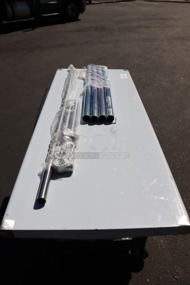 BRAND NEW Steelton 24"x60" 18-Gauge 430 stainless steel work table, open base, wrapped legs, out of packaging.