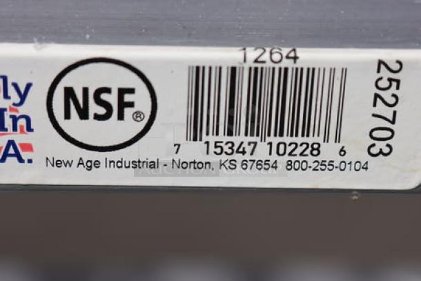 New Age 1264 aluminum lug rack with scuff marks, 29.5"x33"x62", NSF certified, label shows barcode and contact info.