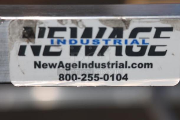 BRAND NEW SCRATCH-N-DENT New Age 1264 heavy-duty aluminum lug rack with scuff marks, 29.5"x33"x62", 10 lug slots.