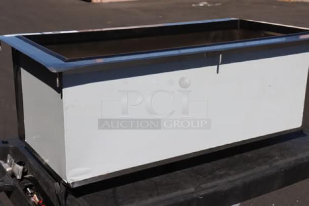 Brand new Regency 600DIIB1836 18"x36" stainless steel drop-in ice bin, scratch-n-dent; bent corners visible.