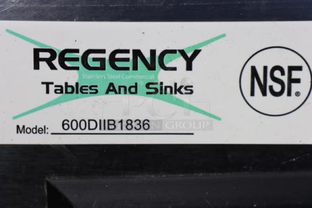 Regency 600DIIB1836 stainless steel drop-in ice bin, brand new with bent corners, NSF certified, model label visible.