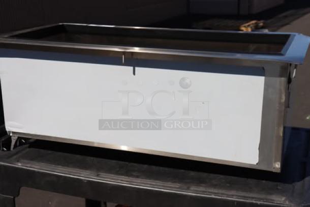 Regency 600DIIB1836 18"x36" stainless steel drop-in ice bin, brand new with bent corners, visible scratch-n-dent condition.