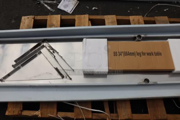 BRAND NEW SCRATCH-N-DENT Regency 600TSSB30120 30"x120" stainless steel work table, 14 gauge, with 4" backsplash, undershelf, parts missing.