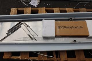 BRAND NEW SCRATCH-N-DENT Regency 600TSSB30120 30"x120" stainless steel work table, 14 gauge, with 4" backsplash, undershelf, parts missing.