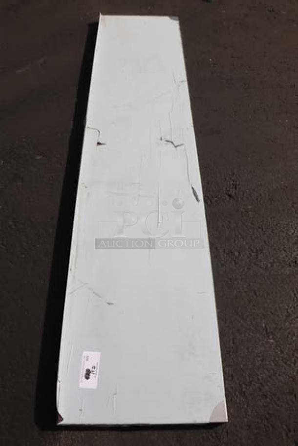 Regency 600WS1884HD wall shelf, 16-gauge stainless steel, 18"x84", scratch-n-dent condition, visible distress on surface.