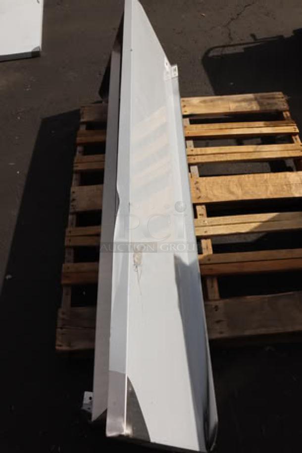 Regency 600PS1872 stainless steel pot rack with shelf, 18"x72", brand new with visible dents. Wall-mounted, ideal for kitchen storage.