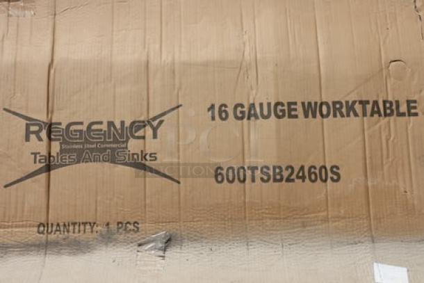 Regency 24"x60" stainless steel work table, model 600TSB2460S, with 4" backsplash. Original packaging damaged.