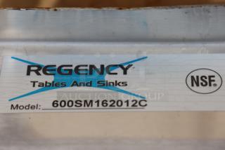 Brand new Regency 600SM162012C 16-gauge stainless steel mop sink, notched front, label visible, 20"x16"x12" bowl.
