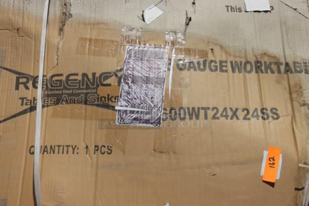 Brand new Regency 600WT24X24SS 24"x24" stainless steel work table in box, slight packaging damage noted.