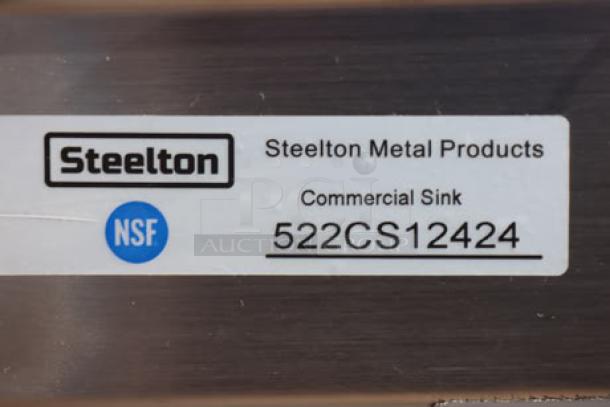 Steelton 522CS12424 label on stainless steel commercial sink, showing brand and NSF certification.