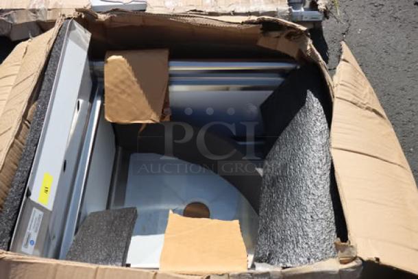 Steelton 29.5" stainless steel commercial sink with dents, model 522CS12424, in cardboard box without original packaging.