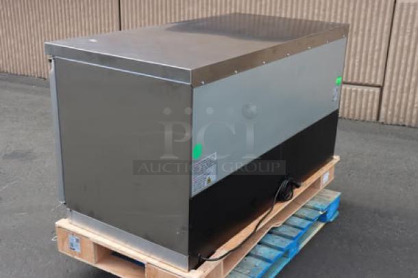 Avantco ZUC-60R-HC 60" undercounter refrigerator, new, minor dents, 115V, 285W, grey finish, placed on a pallet. Serial No. visible.