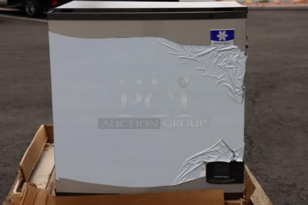 Brand new Manitowoc IYT1200A-261 ice machine, 30" air-cooled, 208-230V, 1213 lb capacity. Cracked top, minor dents; out of packaging.