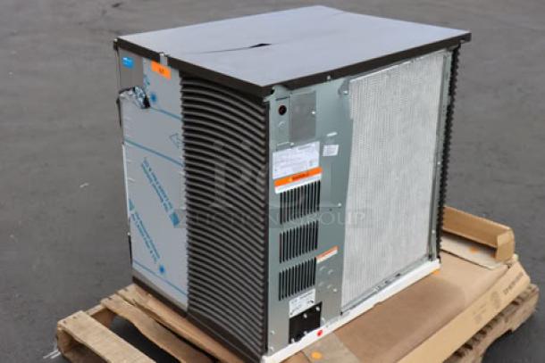 Manitowoc IYT1200A-261 Ice Machine, air-cooled, 30", cracks on plastic top, minor dents, out of packaging, model label visible.