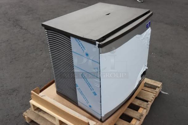 Brand new Manitowoc IYT1200A-261 ice machine, air-cooled, 30" wide, 1213 lb capacity. Cracked top, minor dents. Serial: 1121242752.