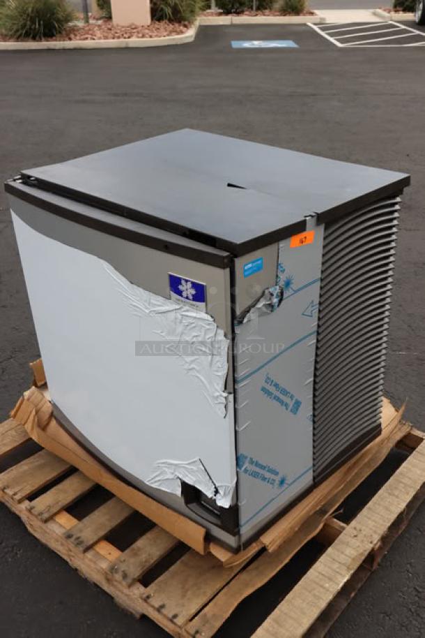 BRAND NEW Manitowoc IYT1200A-261 Ice Machine; plastic top cracked, minor dents; air-cooled; 208-230V, 1213 lb capacity.