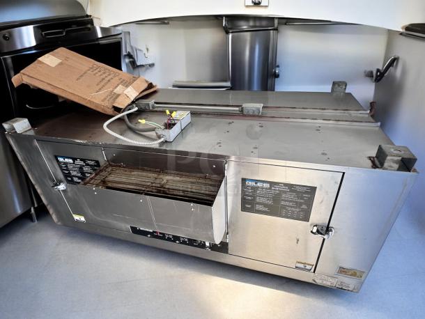 Immaculate Giles FSH-6 ventless hood system with 72" stand. Features labels detailing specifications and maintenance. Fully tested.