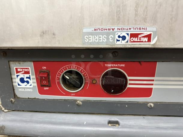 Alt text: Metro C5 3 Series Heated Holding Cabinet, model C539-HFS-U, in red. Features temperature controls, fully tested.