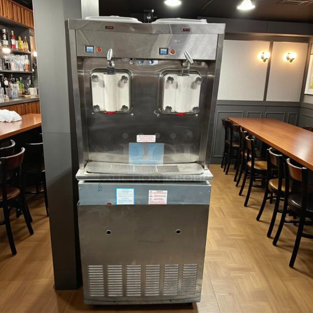 Taylor 321-27 dual flavor soft serve machine in outstanding condition, 208/230V, fully tested, sleek stainless steel design.